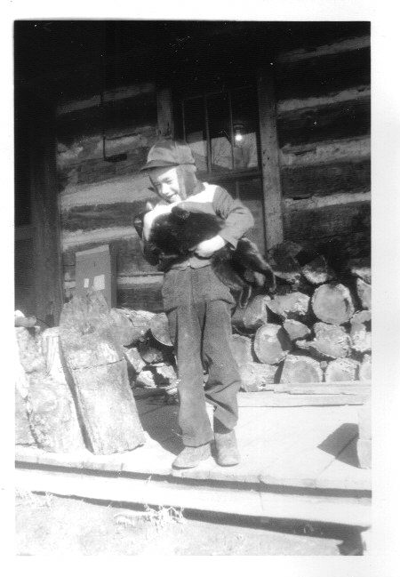 On the family farm in the winter with my cat named Stack.